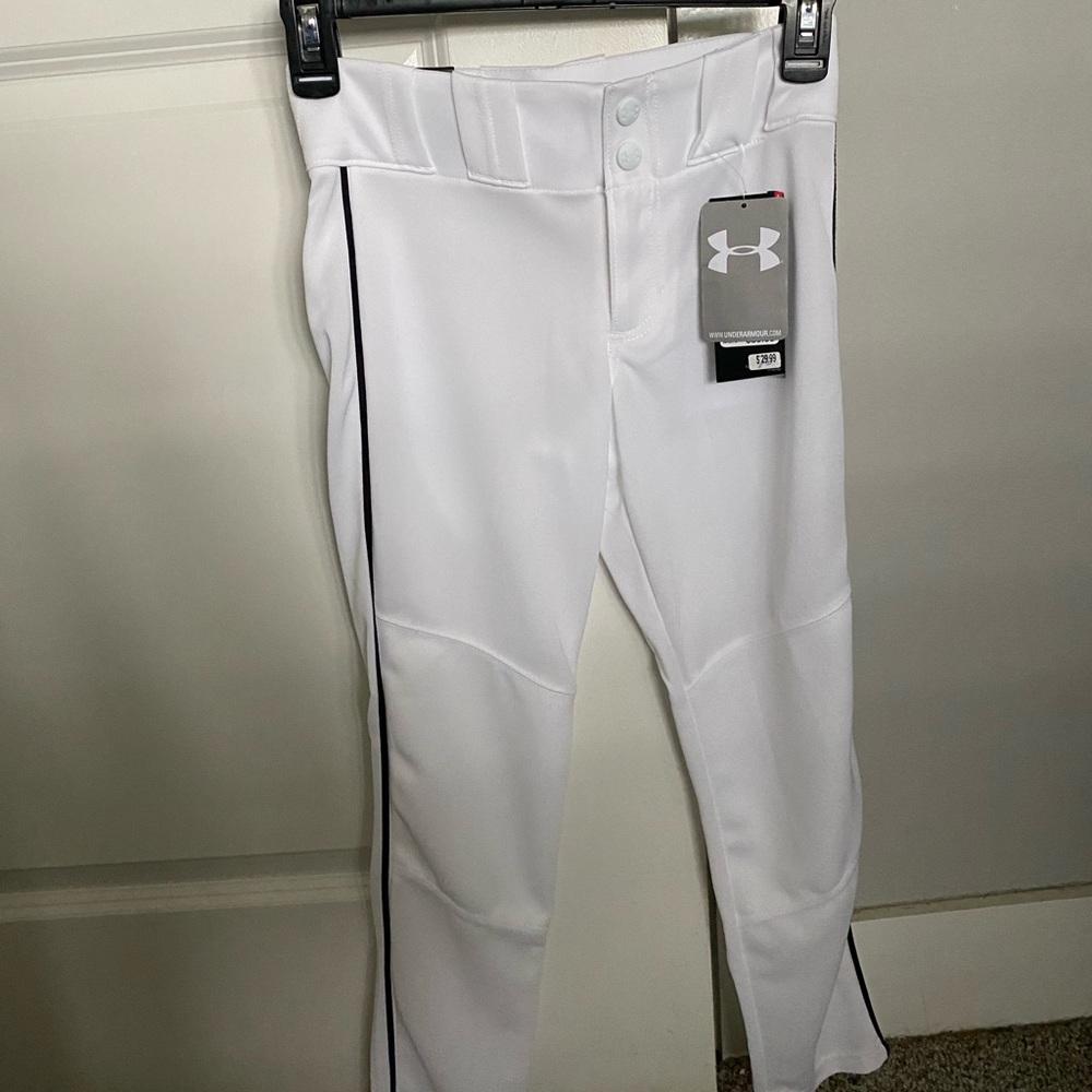 Under Armour White with Navy piping. New with tags. Size youth medium.